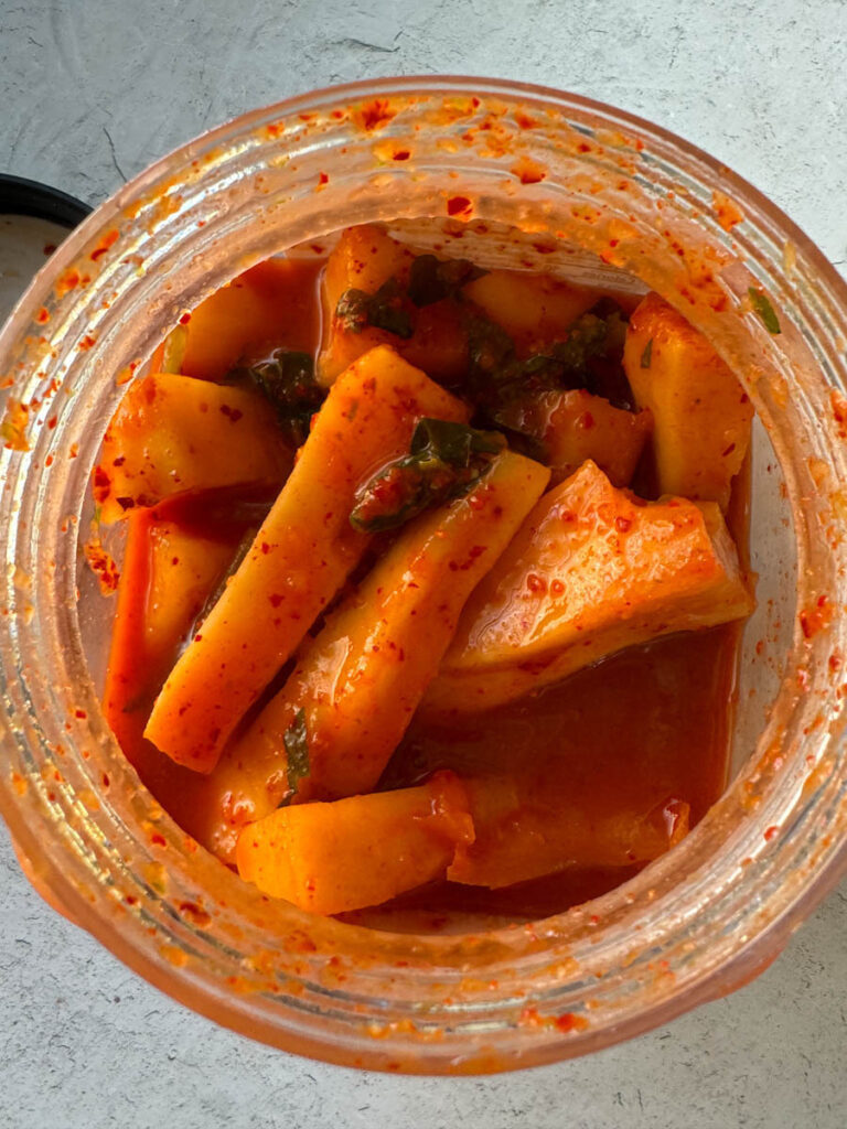 ponytail radish kimchi in the jar