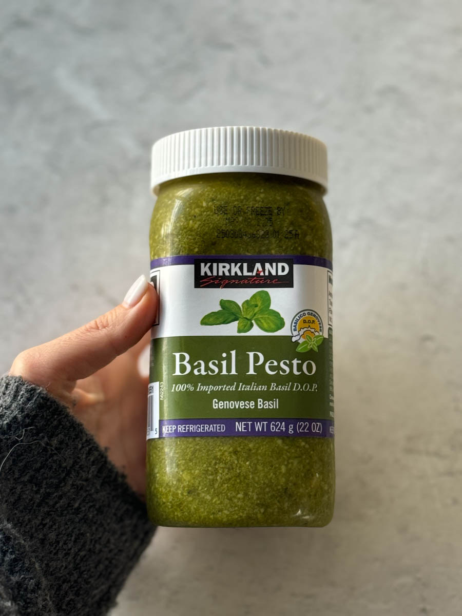 jar of pesto in hand