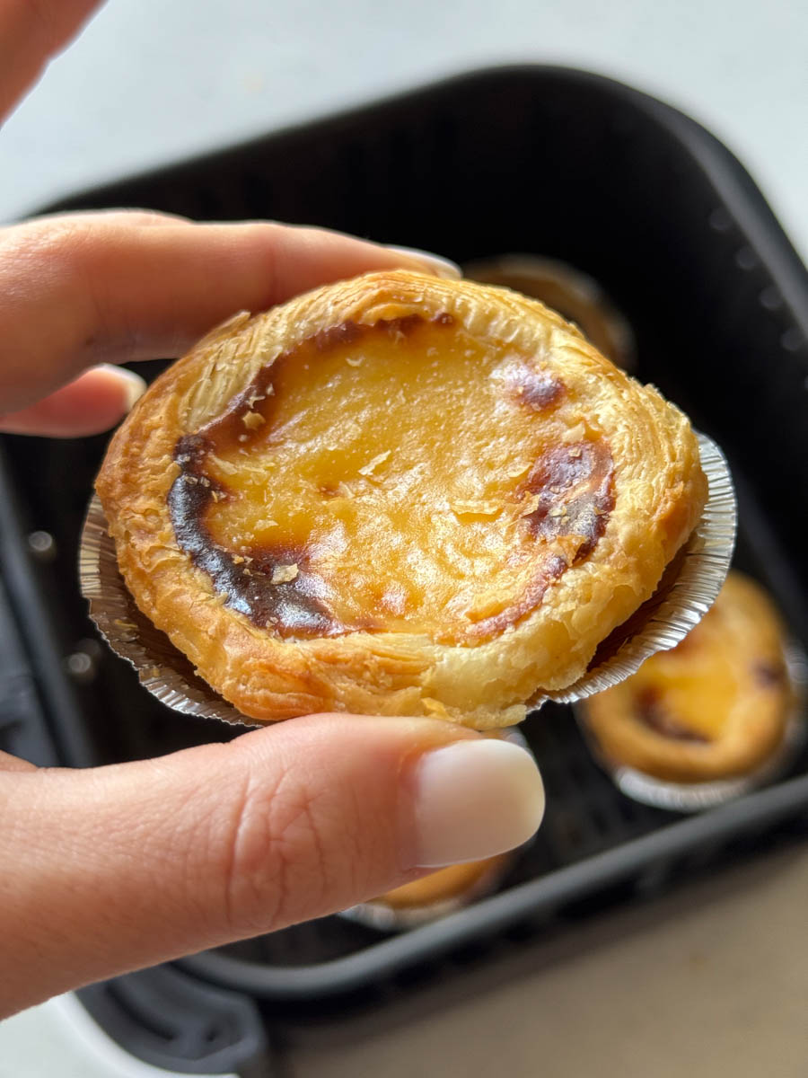 mini custard tart in hand