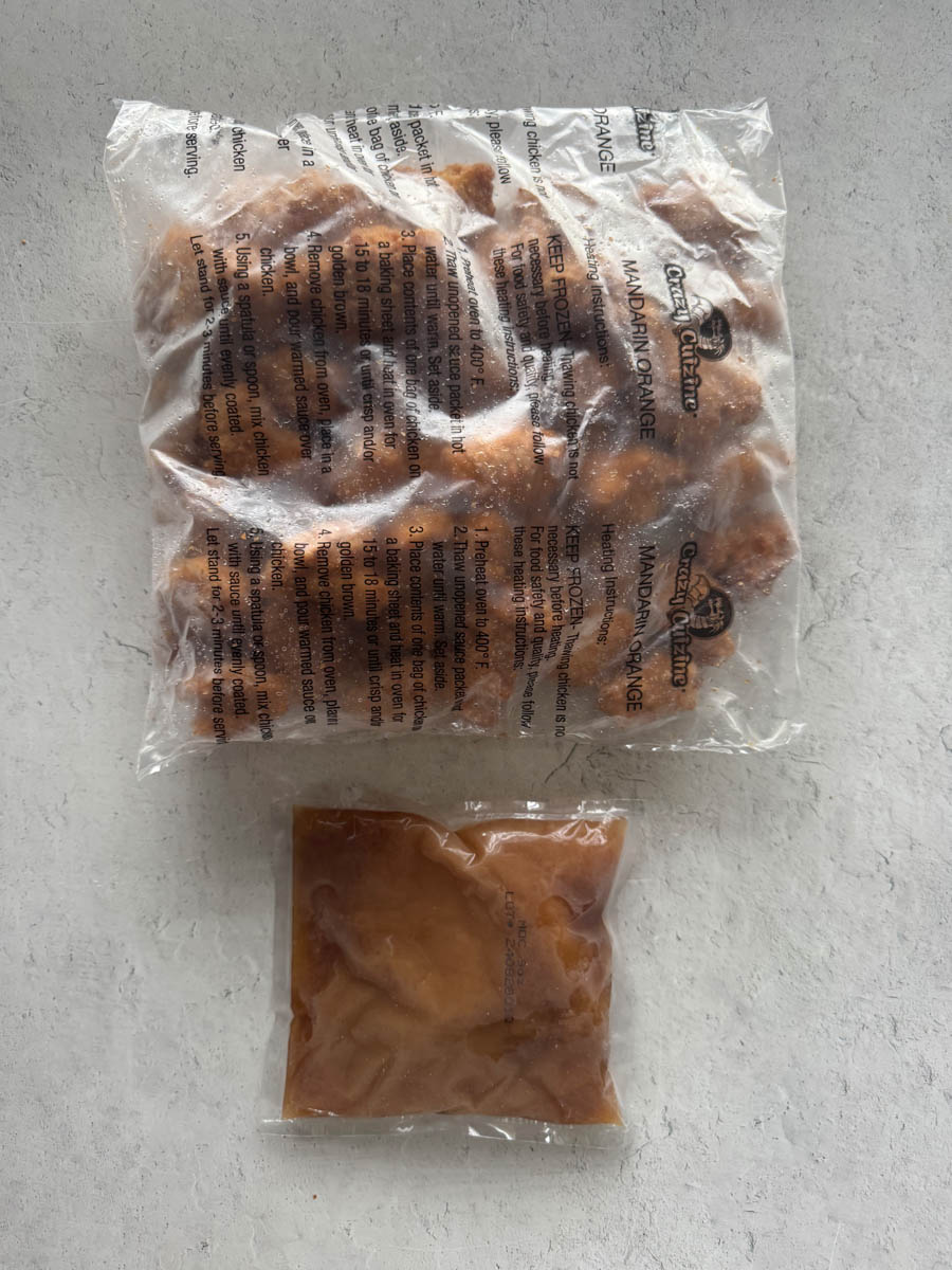 two packages with chicken and sauce that were in the box