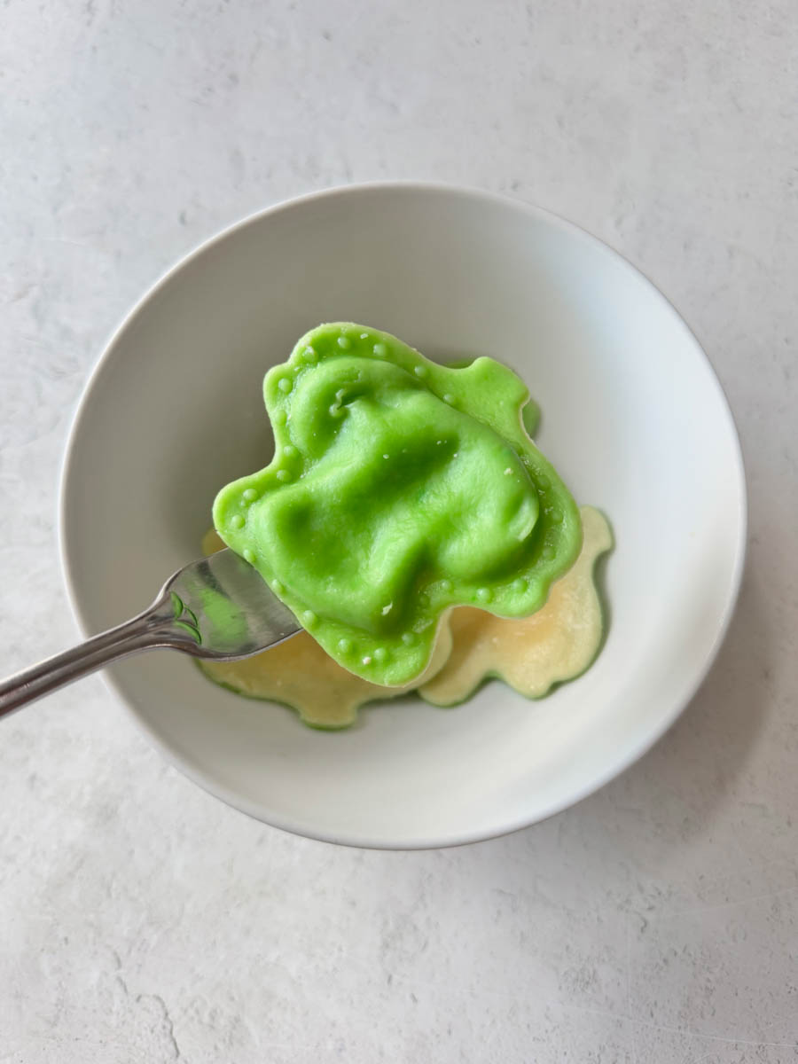 green ravioli on the fork