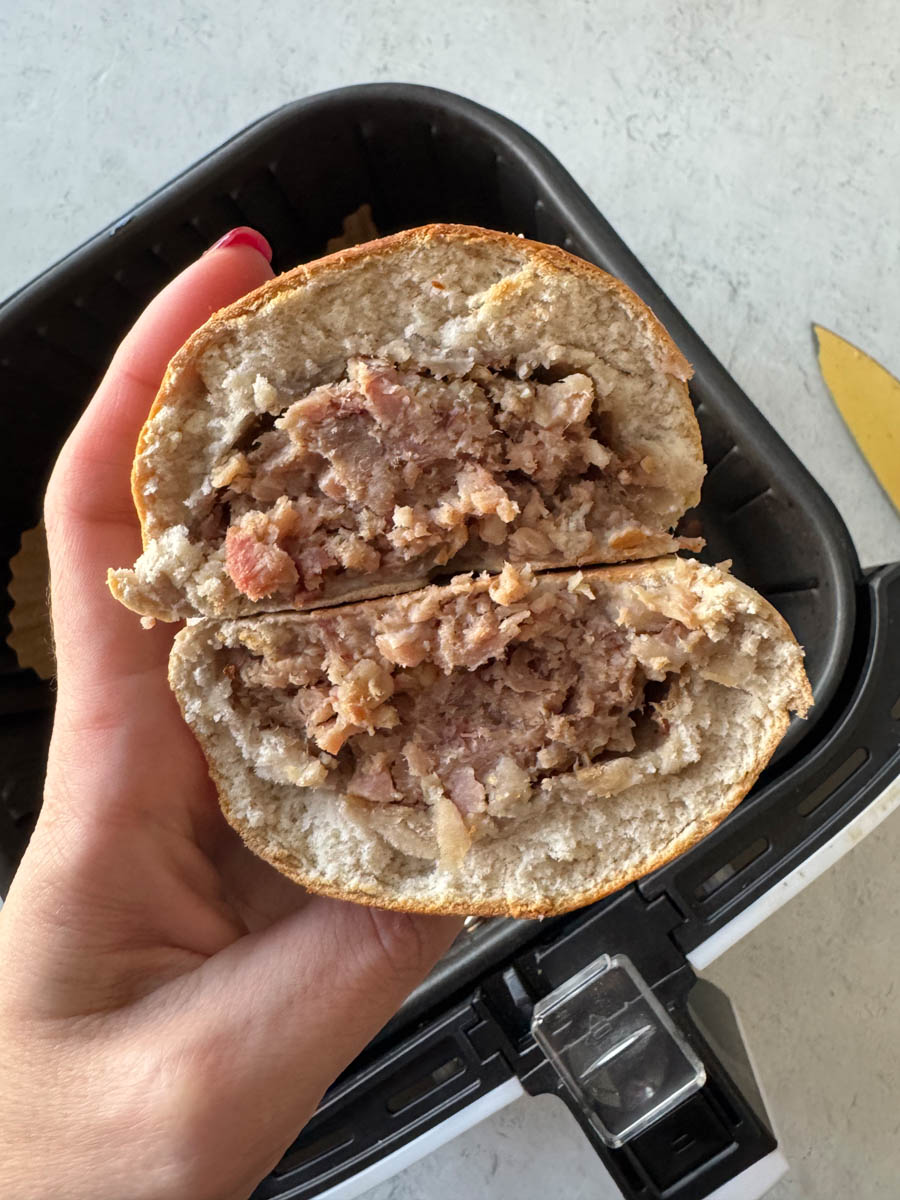 cut open bao in hand