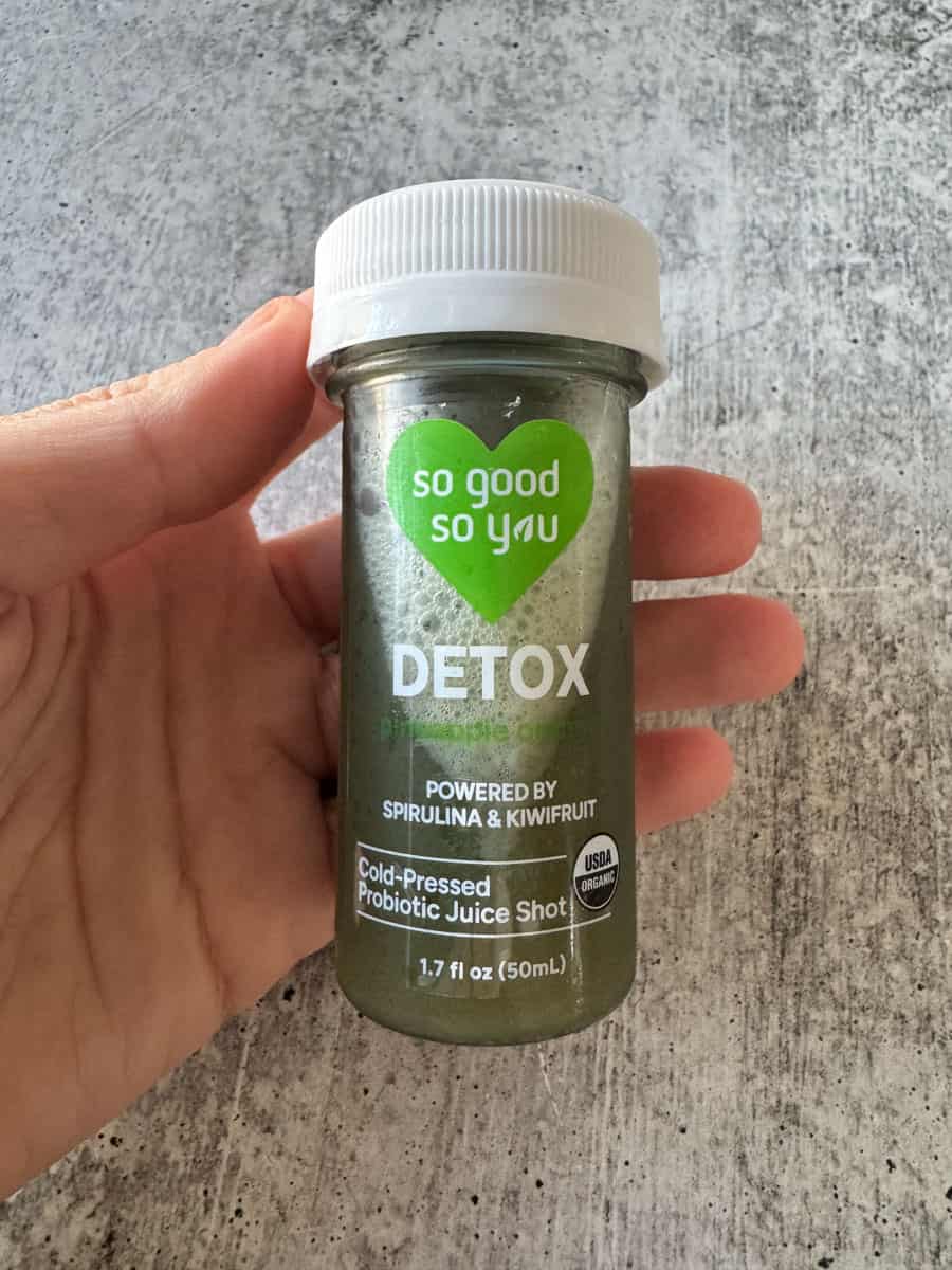 Detox probiotic juice shot in a small bottle with spirulina and kiwi flavor, promoting gut health an.