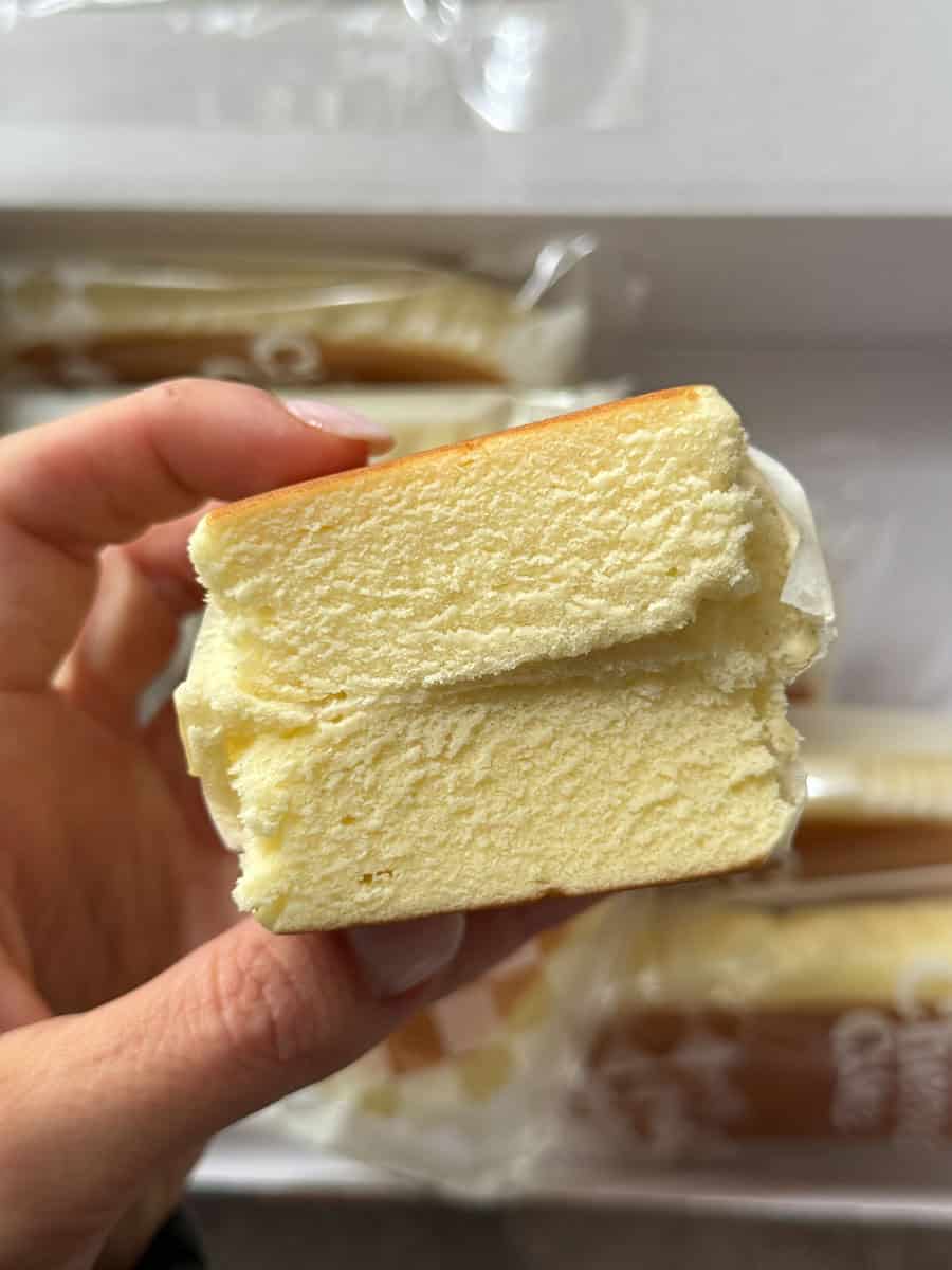 Costco vanilla sponge cake slice with creamy filling, perfect for dessert or snack.