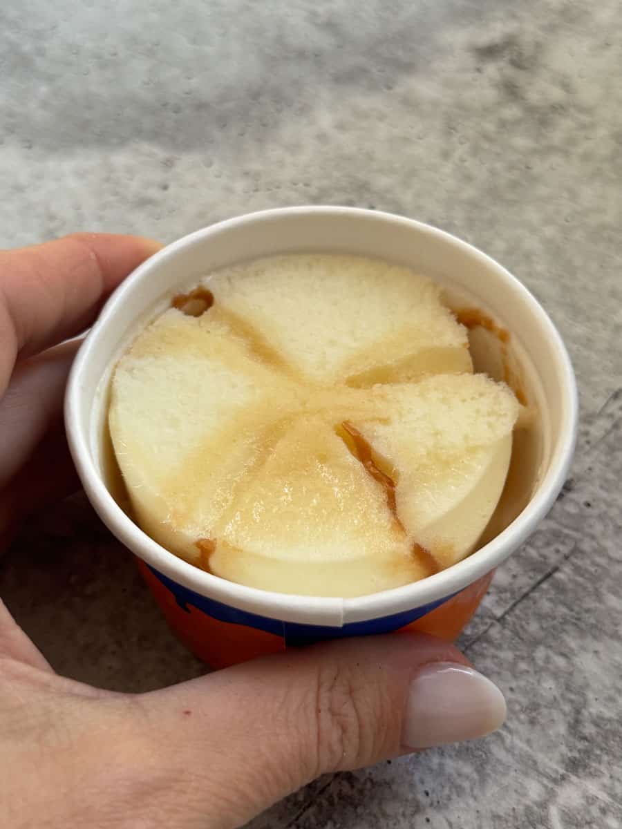 Frozen dessert cup with sliced apples and caramel sauce from Costco.