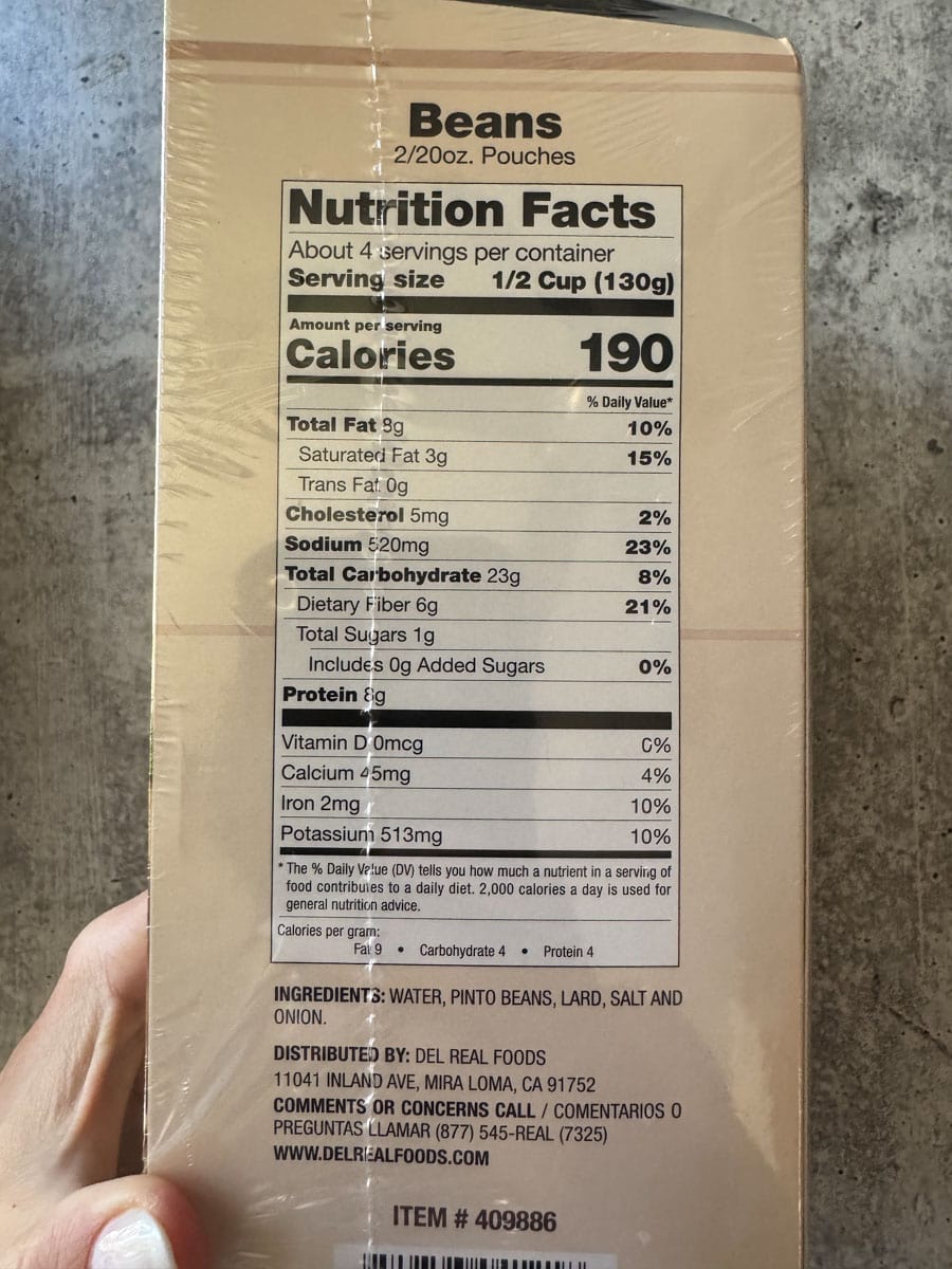 Close-up of a canned beans nutrition label from Costco, showing calories and ingredients.