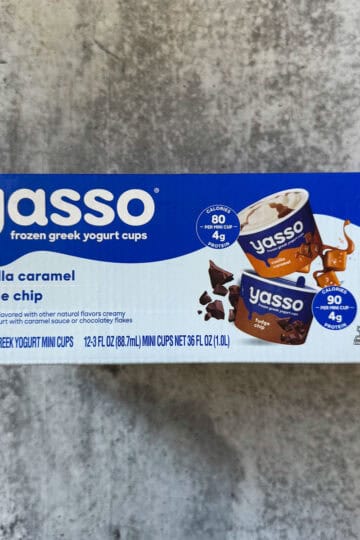 Pack of 12 Yasso vanilla caramel frozen Greek yogurt cups with fudge chips, a healthy dessert option.