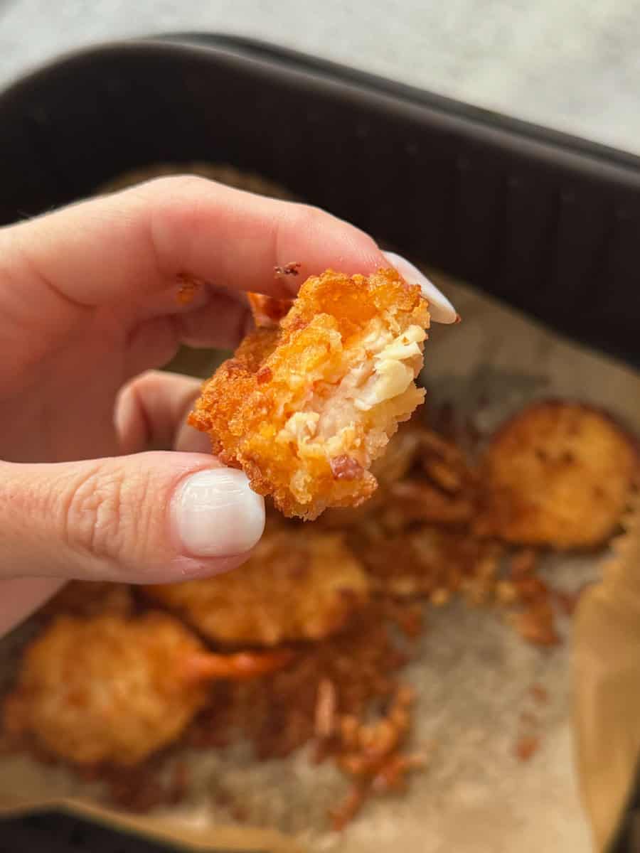Golden crispy chicken tenders with tender meat inside, perfect for snacks or meals.