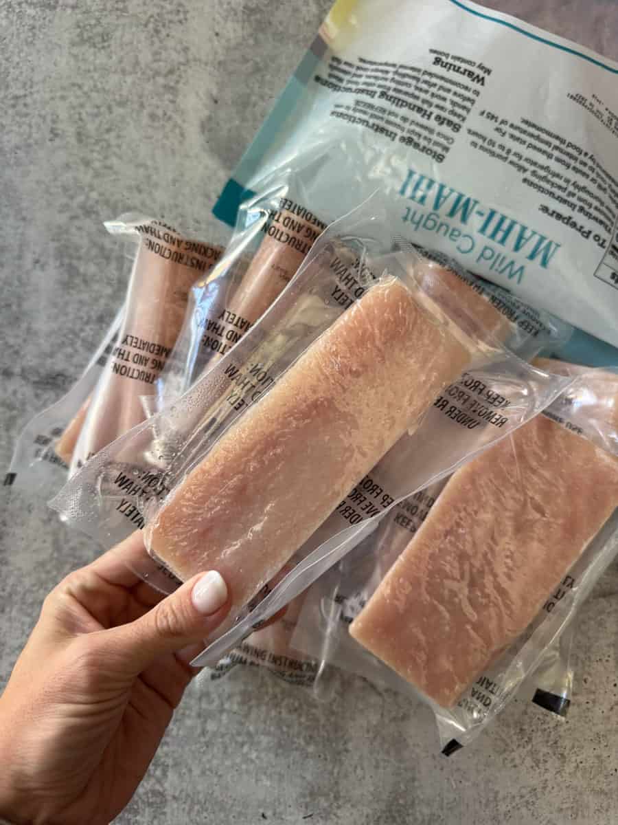 Fresh frozen wild-caught halibut fillets in vacuum-sealed packaging at Costco.