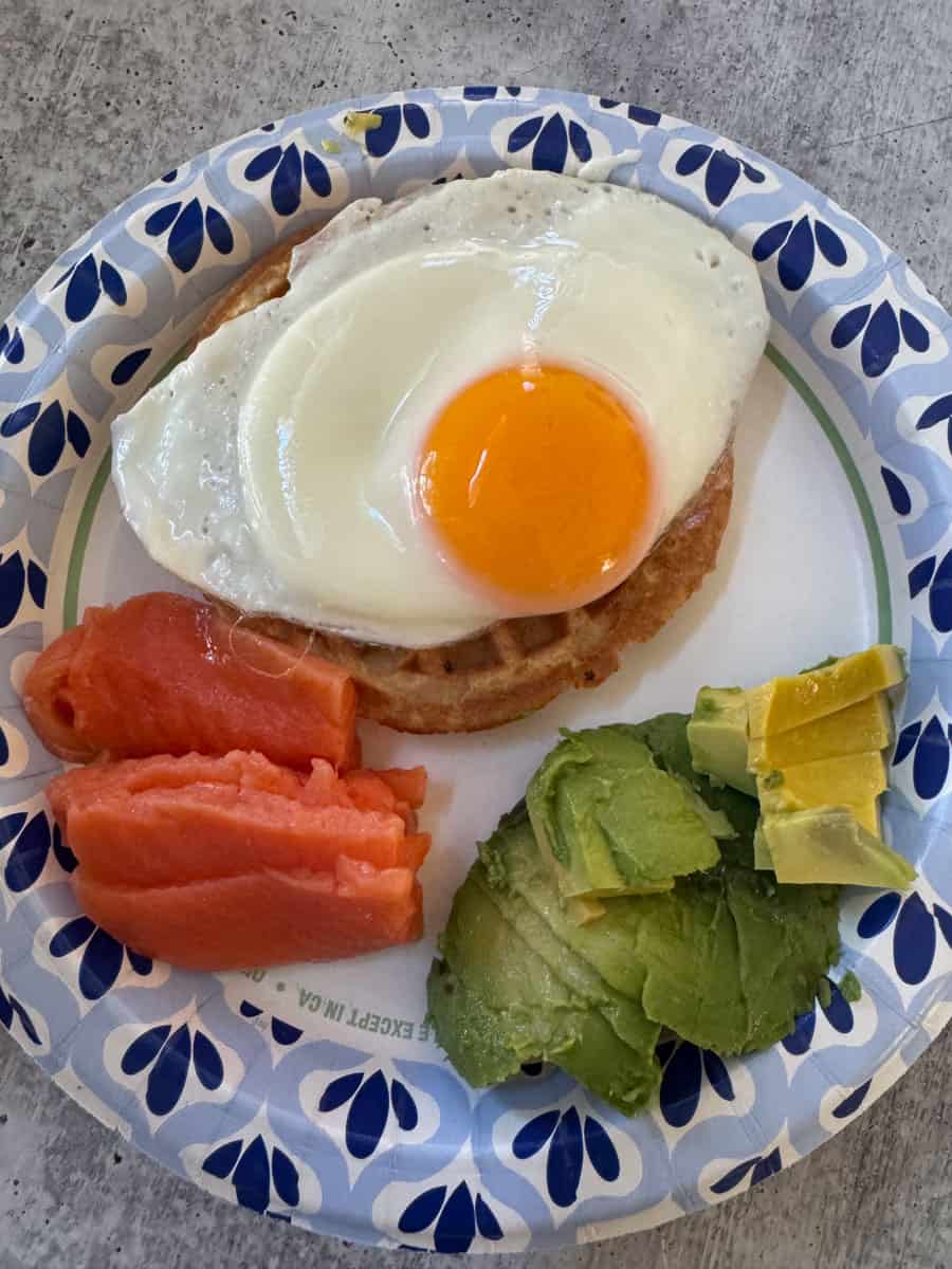 Breakfast plate with fried egg, smoked salmon, and avocado at Costco.