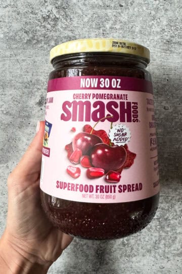 Costco cherry pomegranate superfood fruit spread jar with label details.